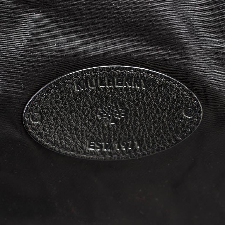 A foldable Mulberry weekend bag.