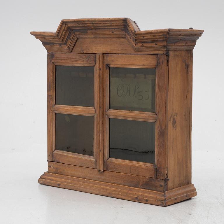 A 18th century wall vitrine cabinet.
