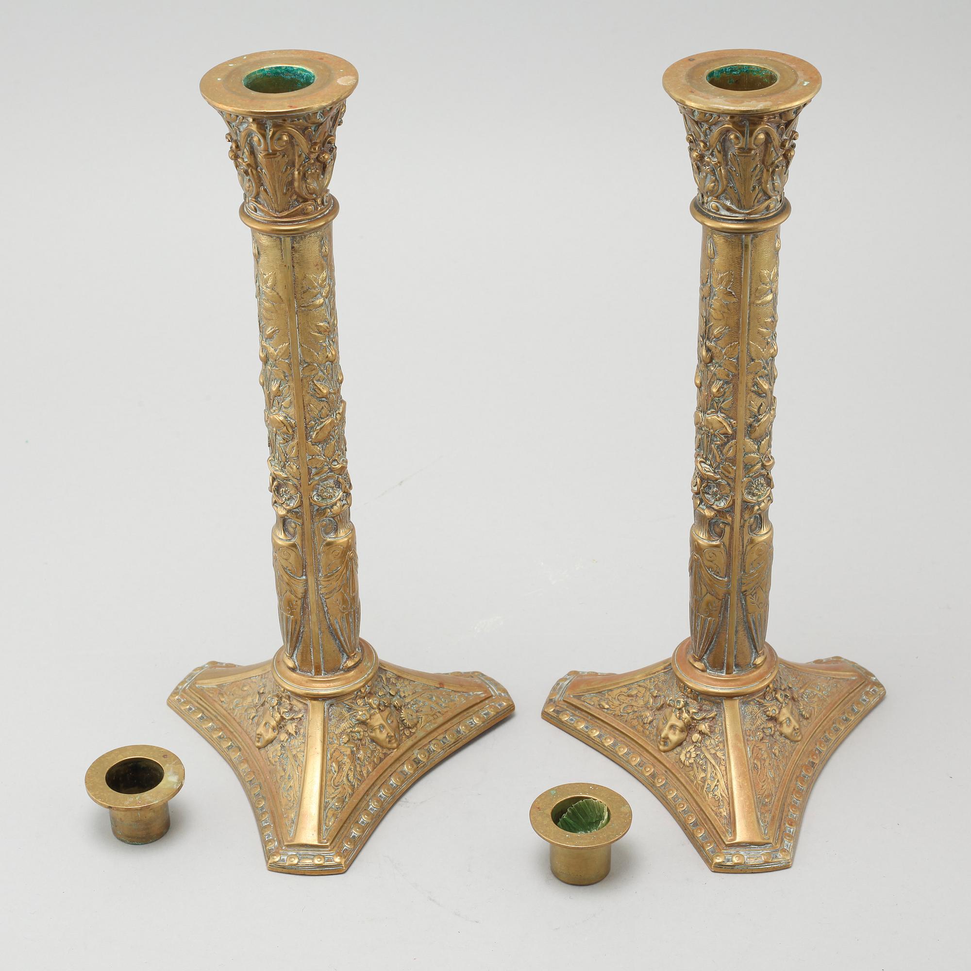 A pair of brass candlesticks from Elkingtons in Birmingham, 19th century.