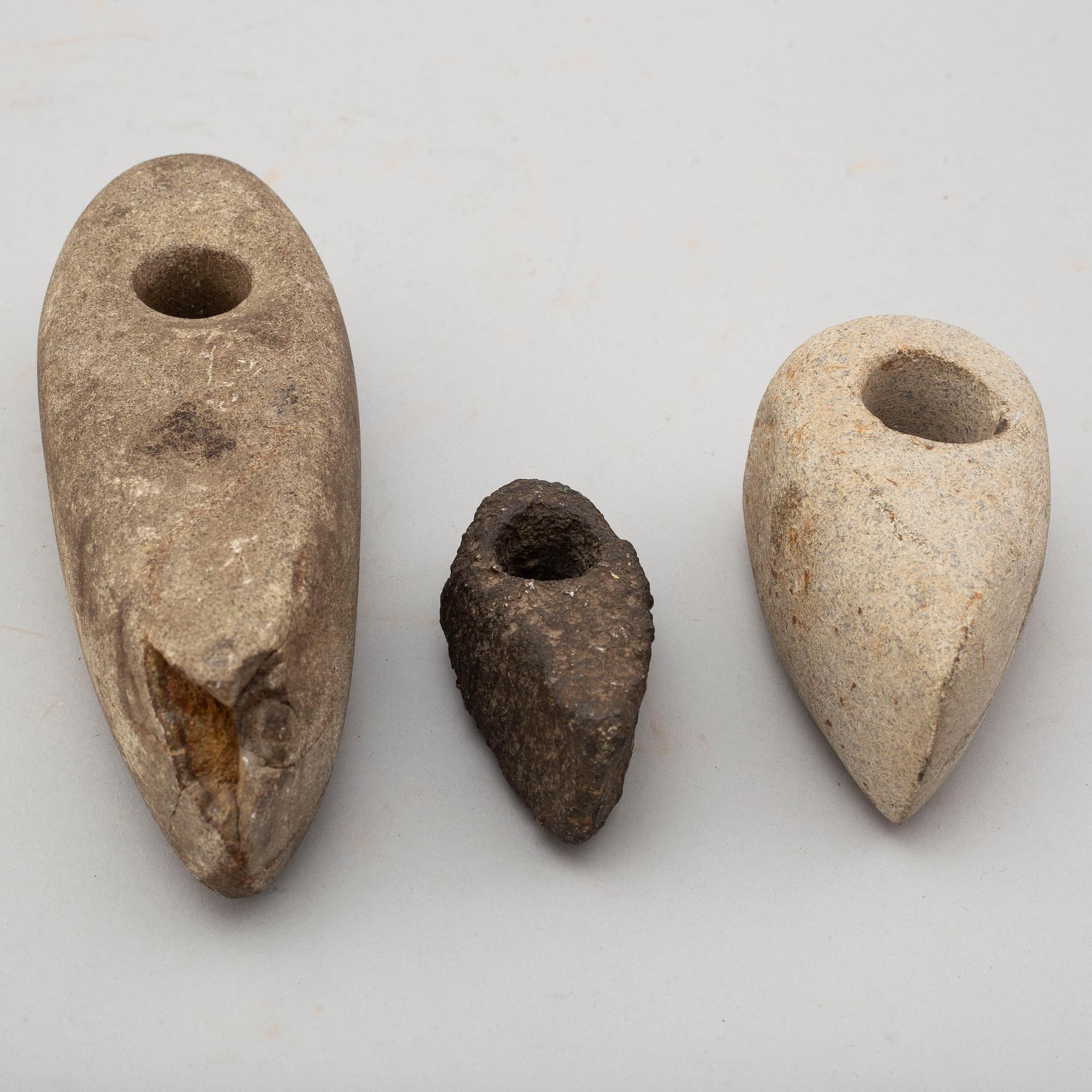 Three neolithic stone axes.