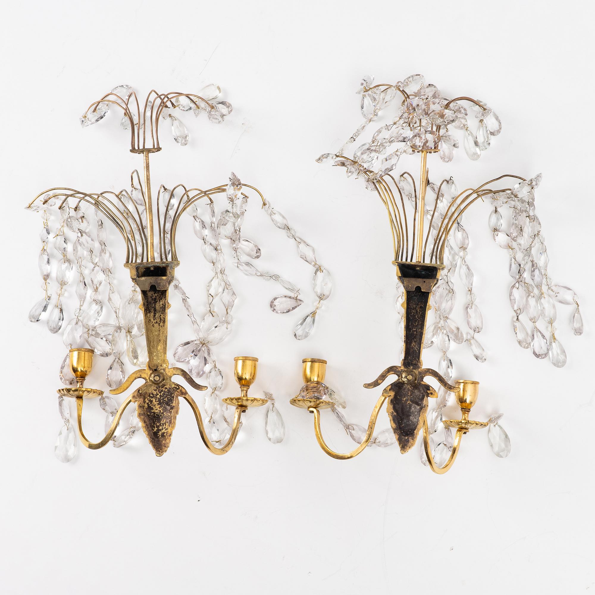A pair of late Gustavian ormolu two-branch lustres, circa 1800.