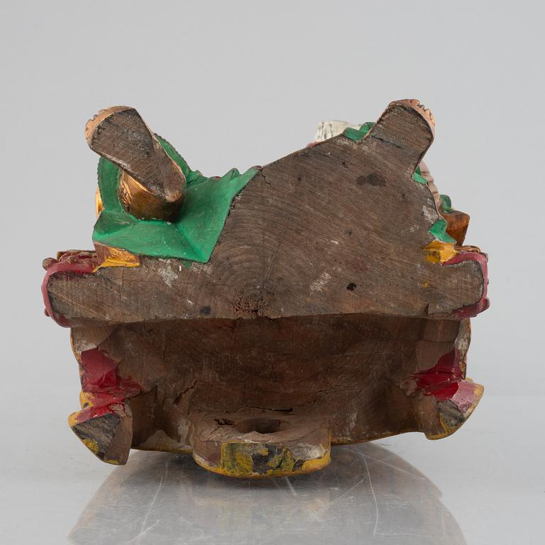 A Chinese lacquered wood figure, 20th century.