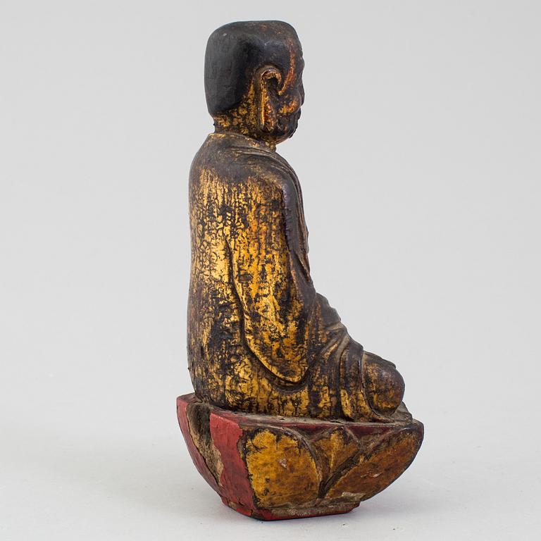 A wooden Japanese sculpture of a deity, 19th Century.