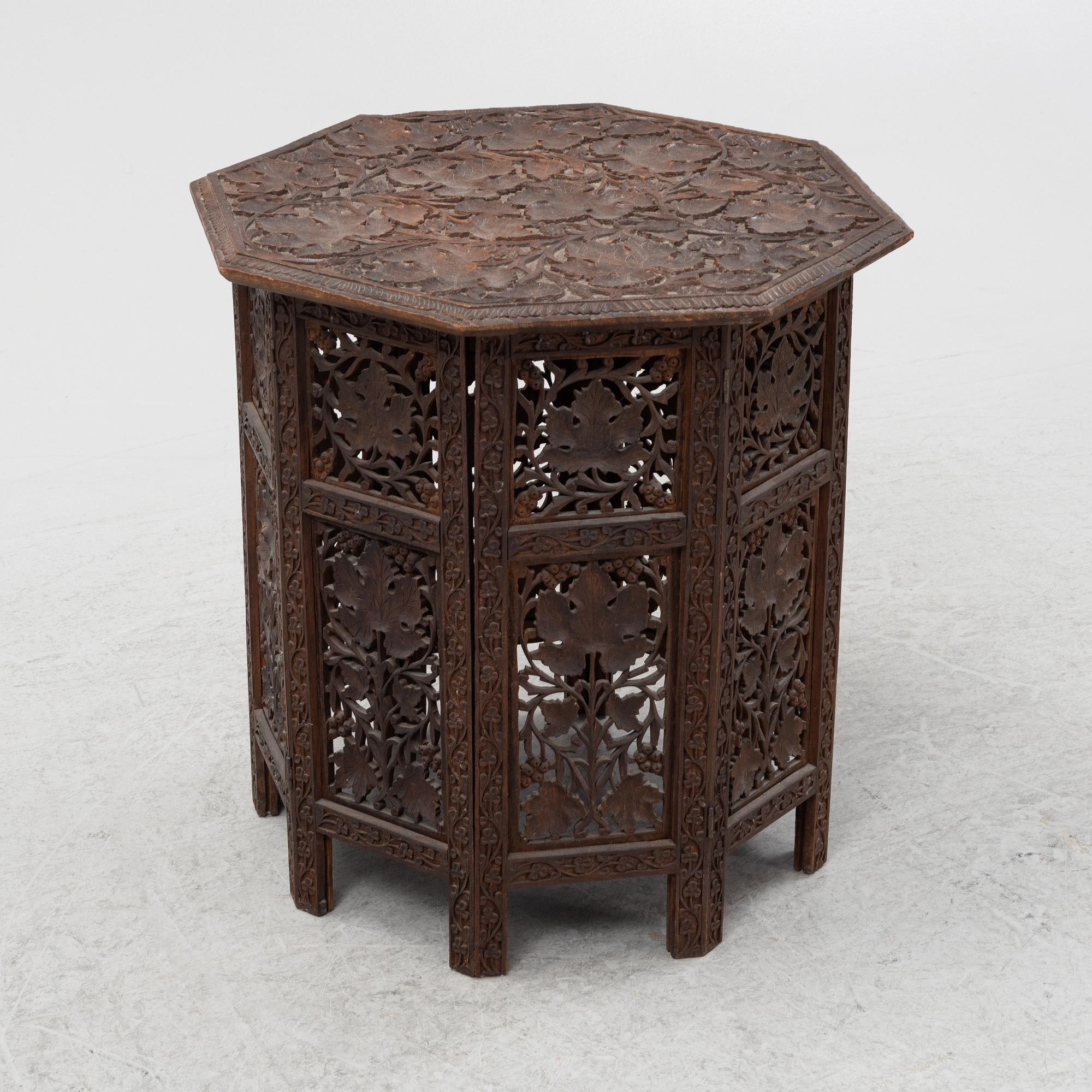 A carved table, first half of the 20th Century.