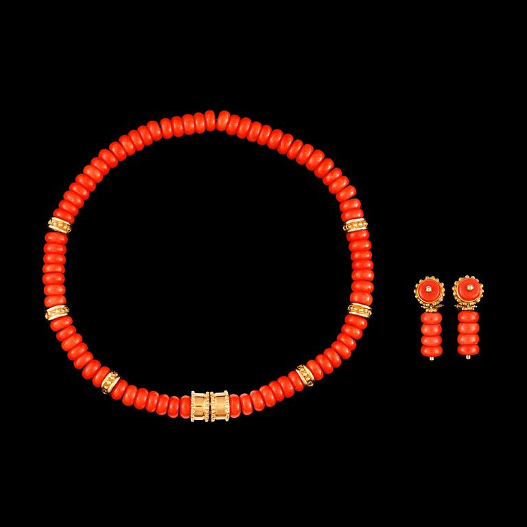 A coral and gold necklace.