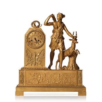 86. A French Empire early 19th century mantel clock.