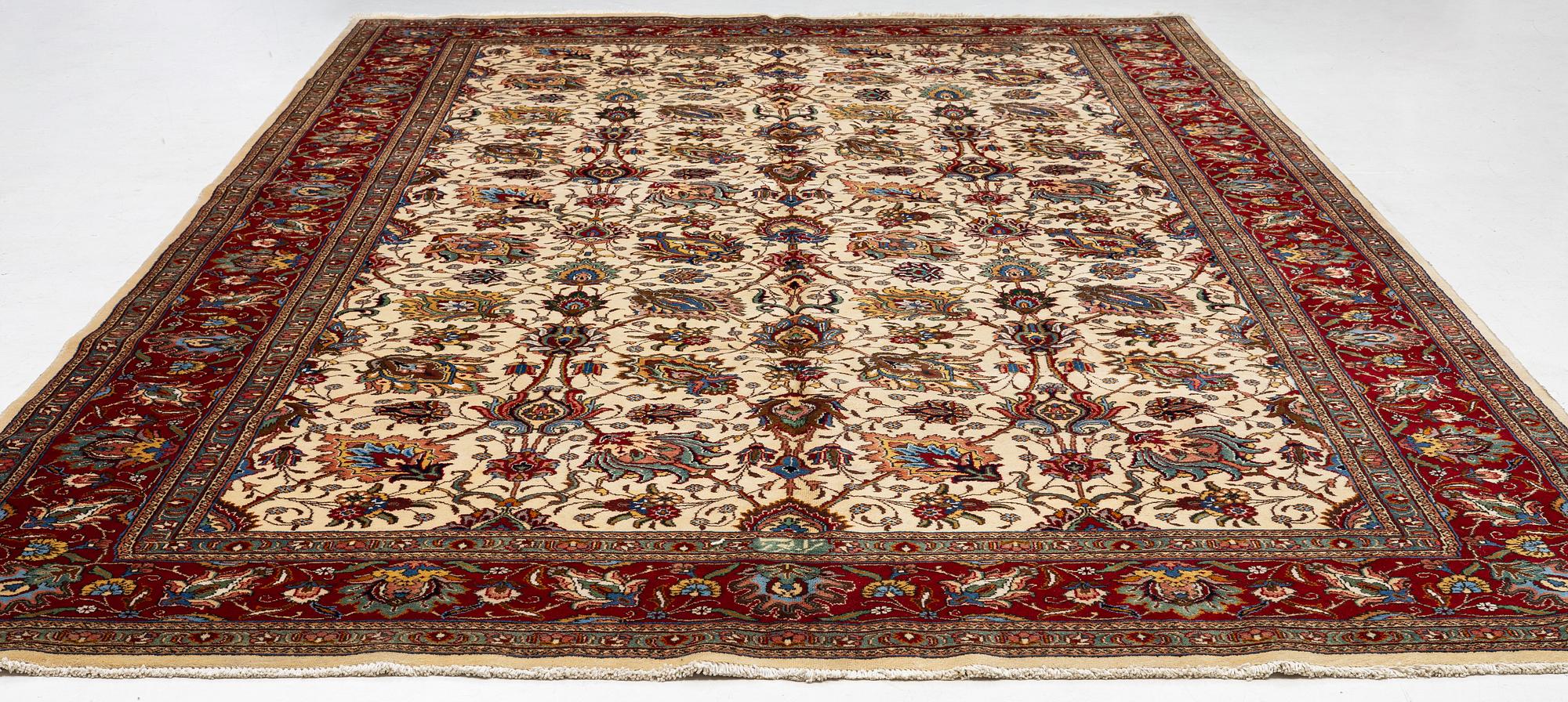 A Tabriz carpet, Northwestern Iran, of Safavid 'palmette' design, c, 483 x 302 cm.