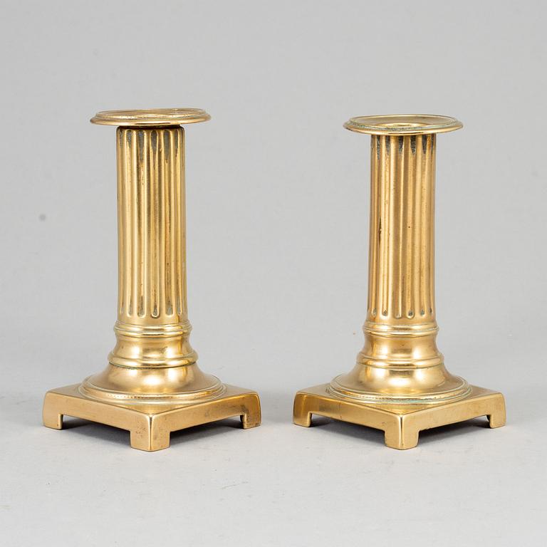 A pair of Louis Seize bronze candlesticks, late 18th century.