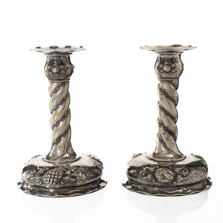 A pair of Baroque style silver candlesticks, marks of CG Hallberg, Stockholm 1942.