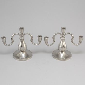 A pair of pewter candelabra from GAB Tenn, Stockholm, 1935.