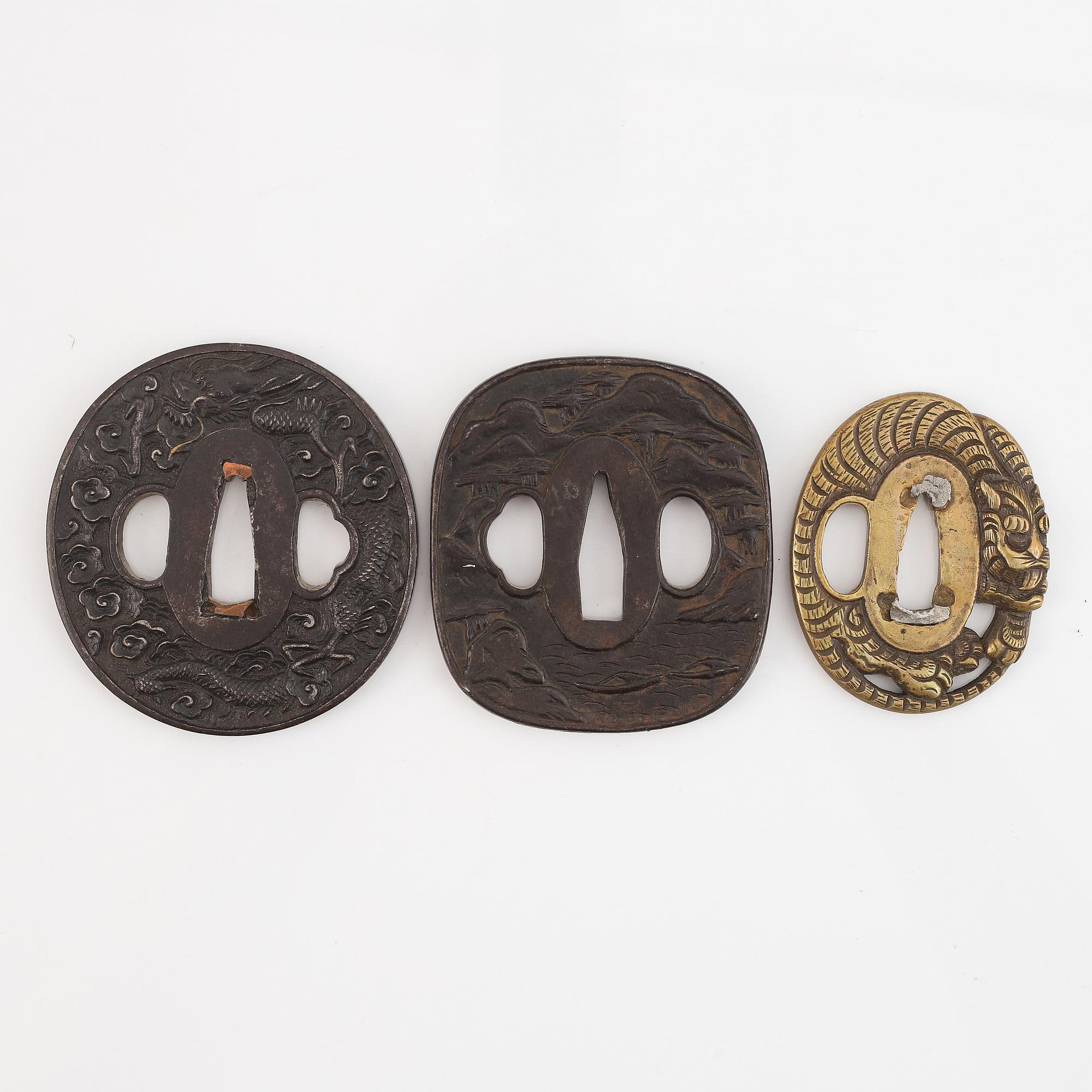 Five tsubas, iron and brass, Edo/Meiji period.