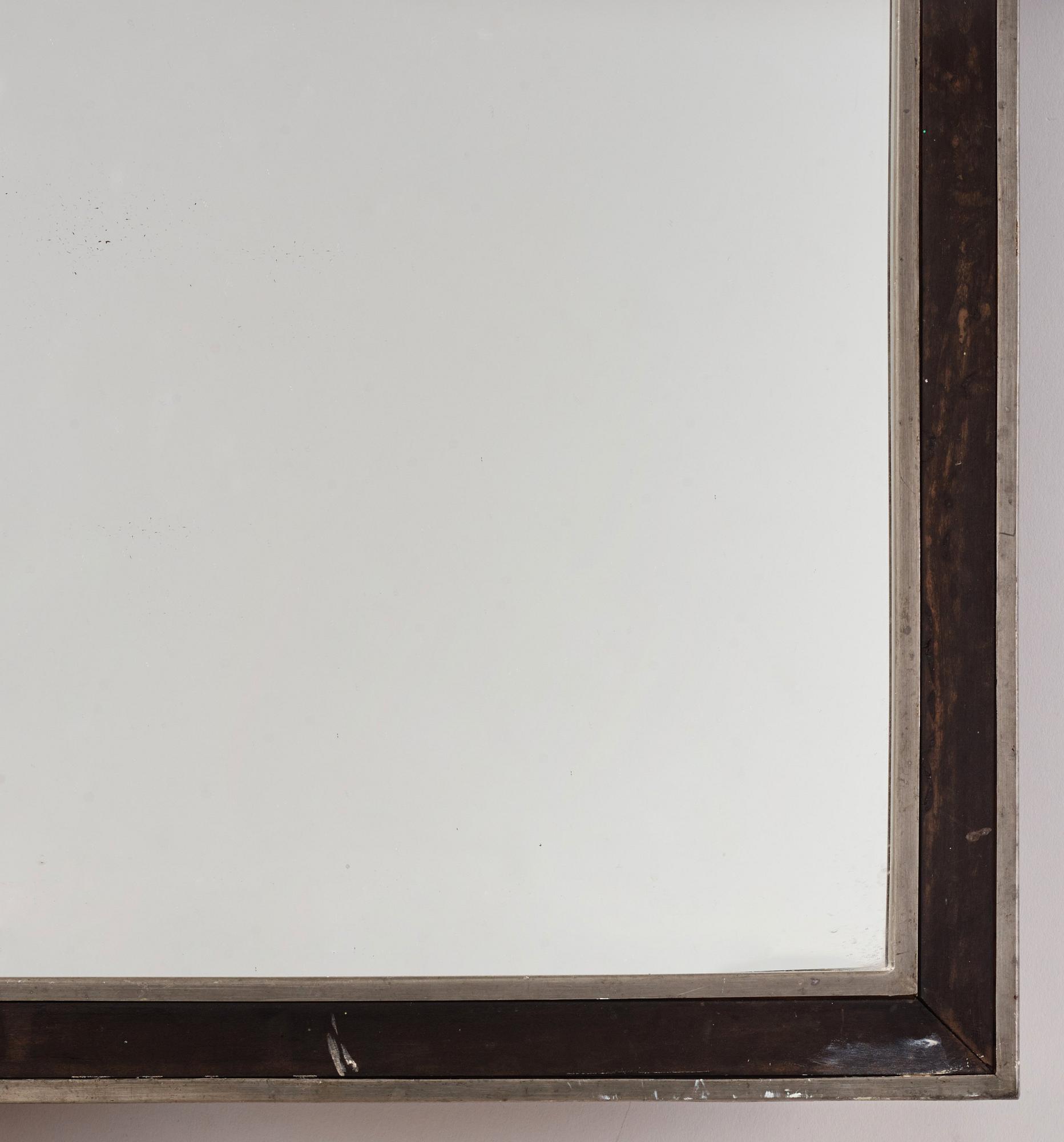 Uno Åhrén, a rare ebonized pear wood and pewter mirror, Firma Svenskt Tenn, early 1930s.