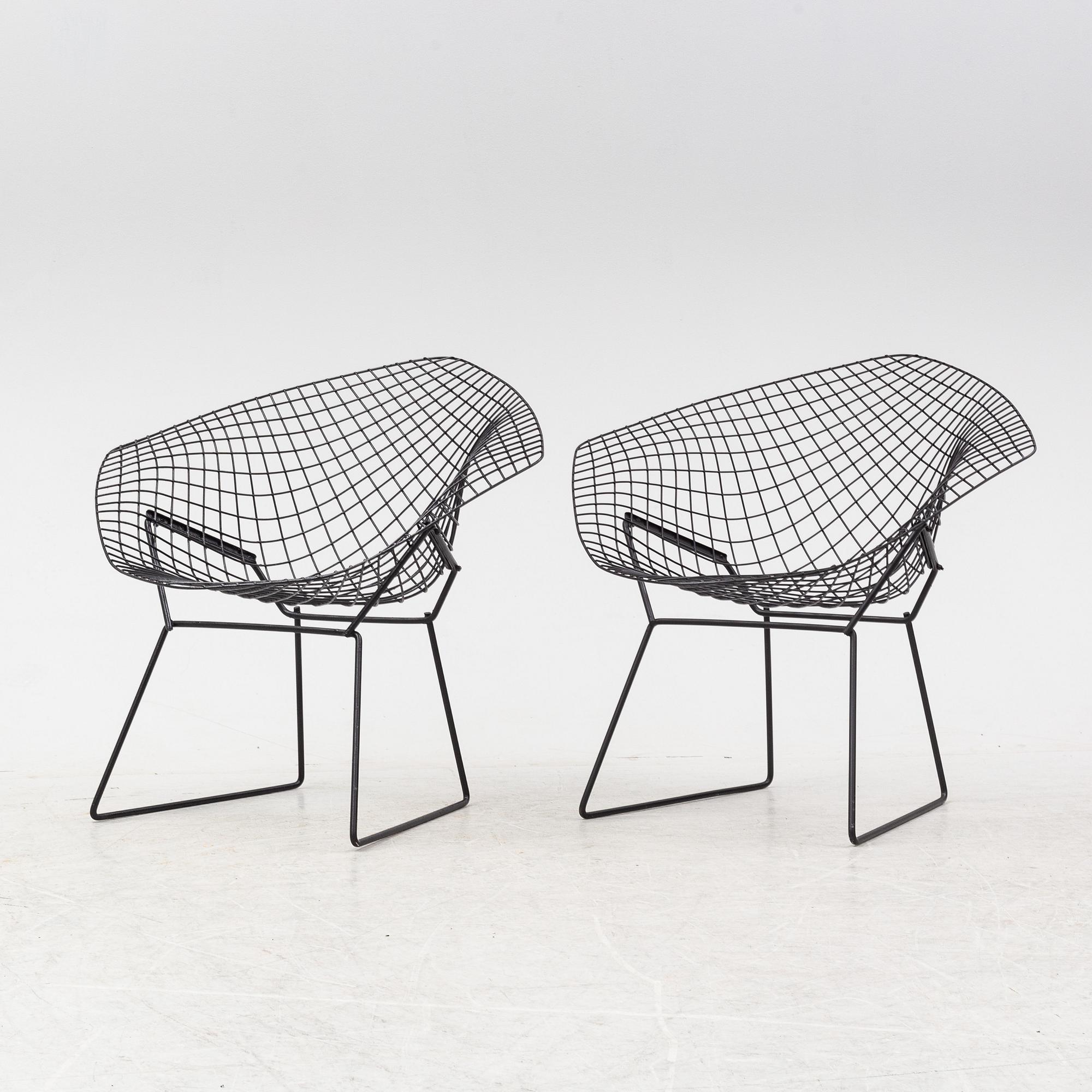 Harry Bertoia, a pair of metal lounge chairs, 1960's.