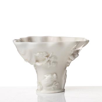 A blanc de chine rhinoserous libation cup, Qing dynasty, Kangxi (1662-1722).