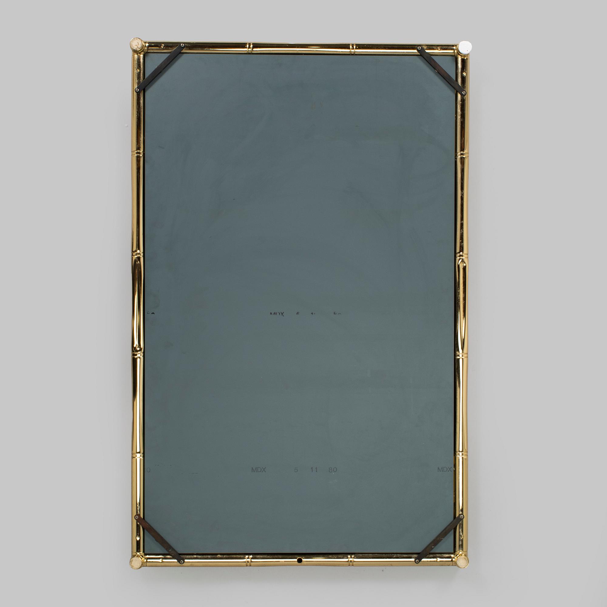A 1970s/80s brass mirror.