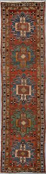 A Heriz runner, ca 310 x 85 cm.
