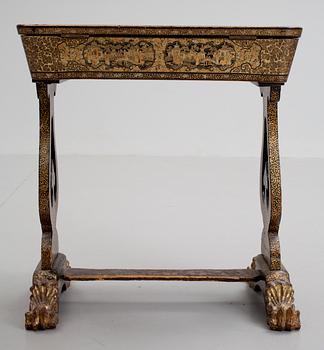 A gold and black lacquer sewing table, Qing dynasty, ca 1800.