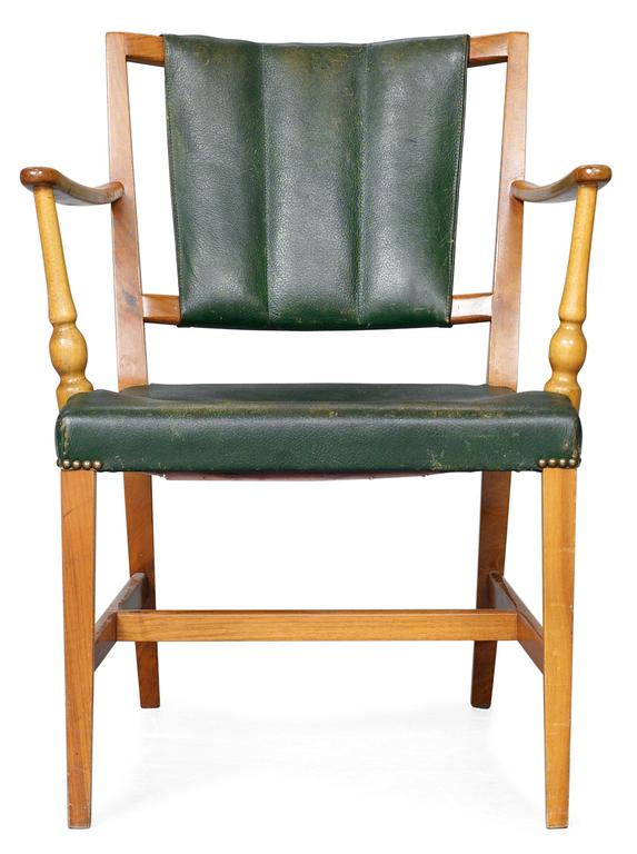 A Josef Frank mahogany and green leather easy chair, Firma Svenskt Tenn.