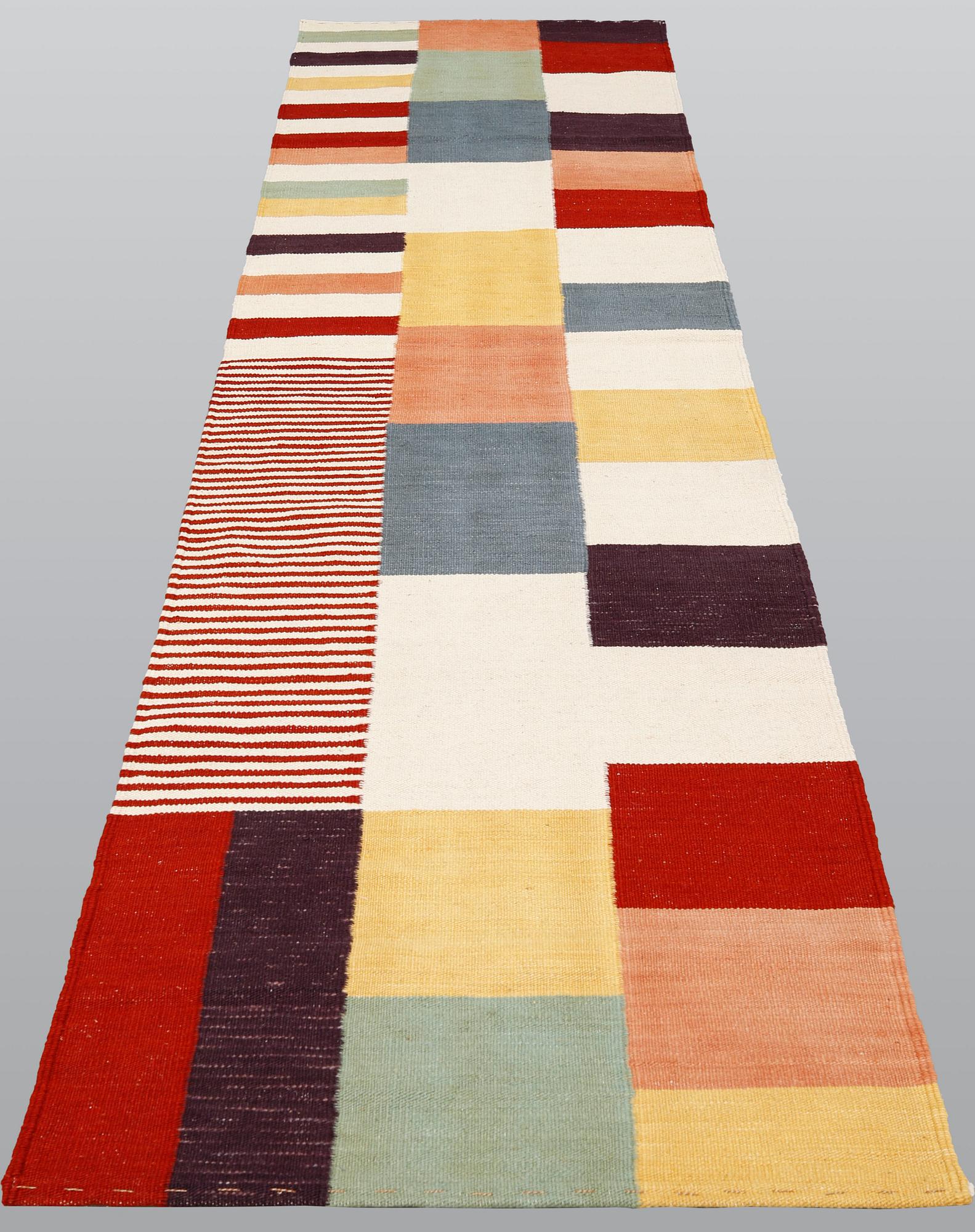 A carpet, flat weave, ca 292 x 80 cm.