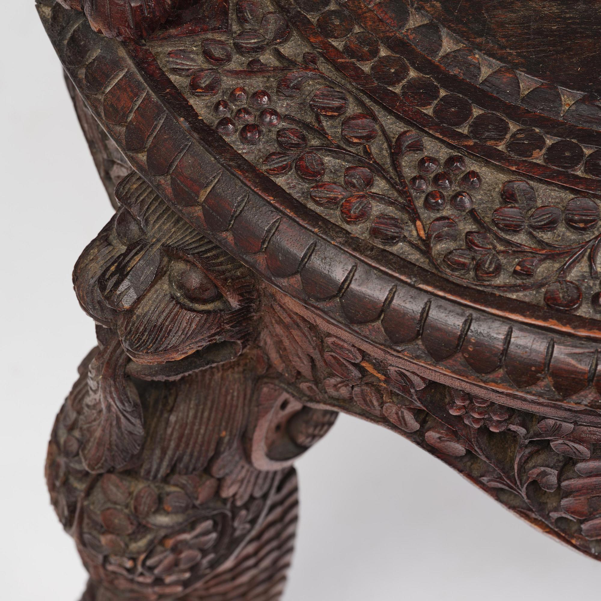 A pair of carved 'blackwood' armchairs, Bombay presidency, British Raj, circa 1880.