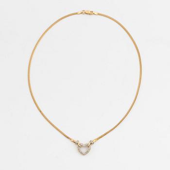 Gold and small diamond heart necklace.
