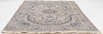A Nain carpet, c. 310 x 195 cm.
