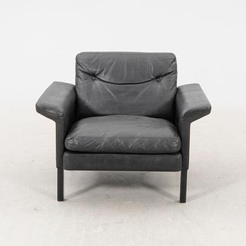 A 1960/70s Hans Olsen leather armchair.