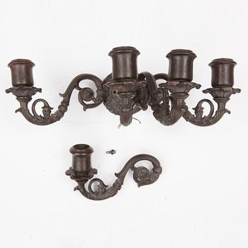 An early 20th century cast iron vall sconce candleholder for five candles.