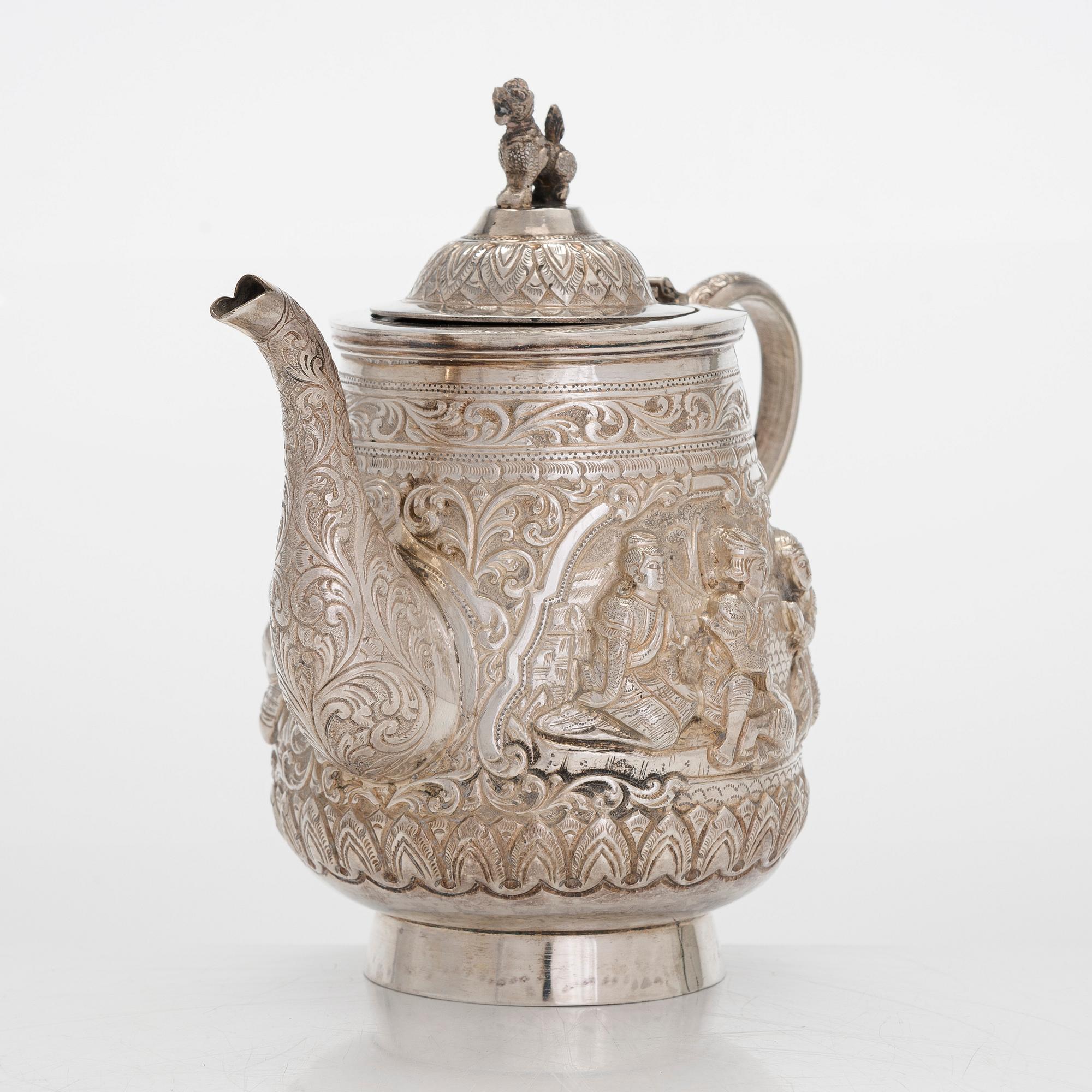 A silver teapot, China.