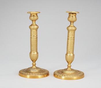 A pair of French Empire early 19th Century candlesticks.