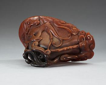 A finely carved rhinoceros libation cup, Qing dynasty, Kangxi (1662-1722).