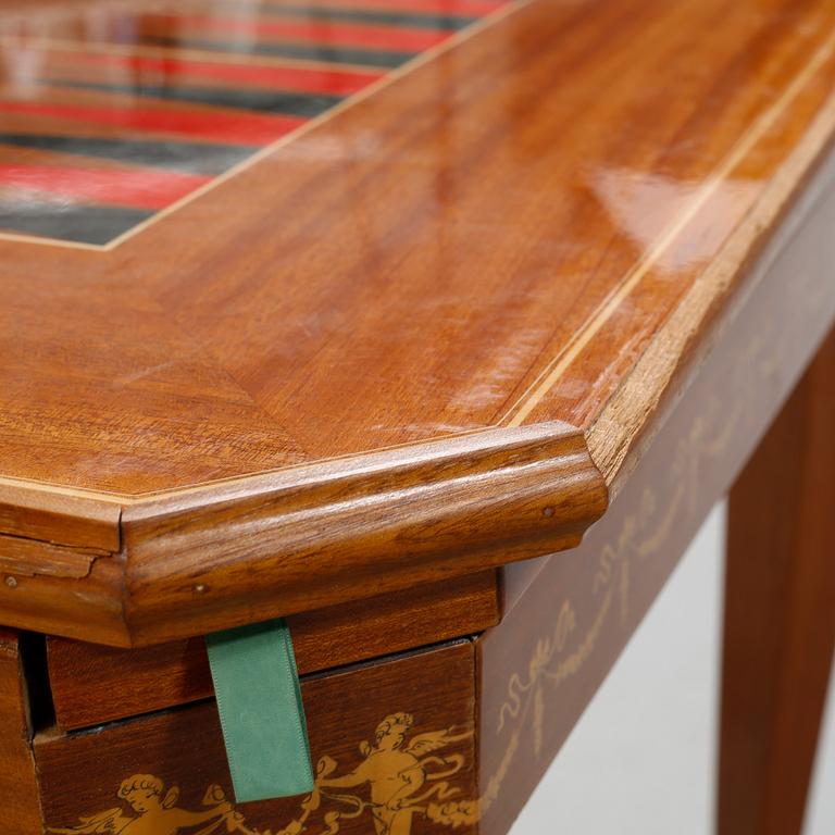 A gaming table and two chairs from Italy, 1950s.