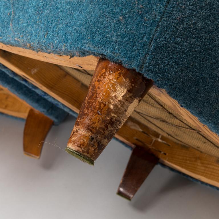A pair of mid-20th-century armchairs.