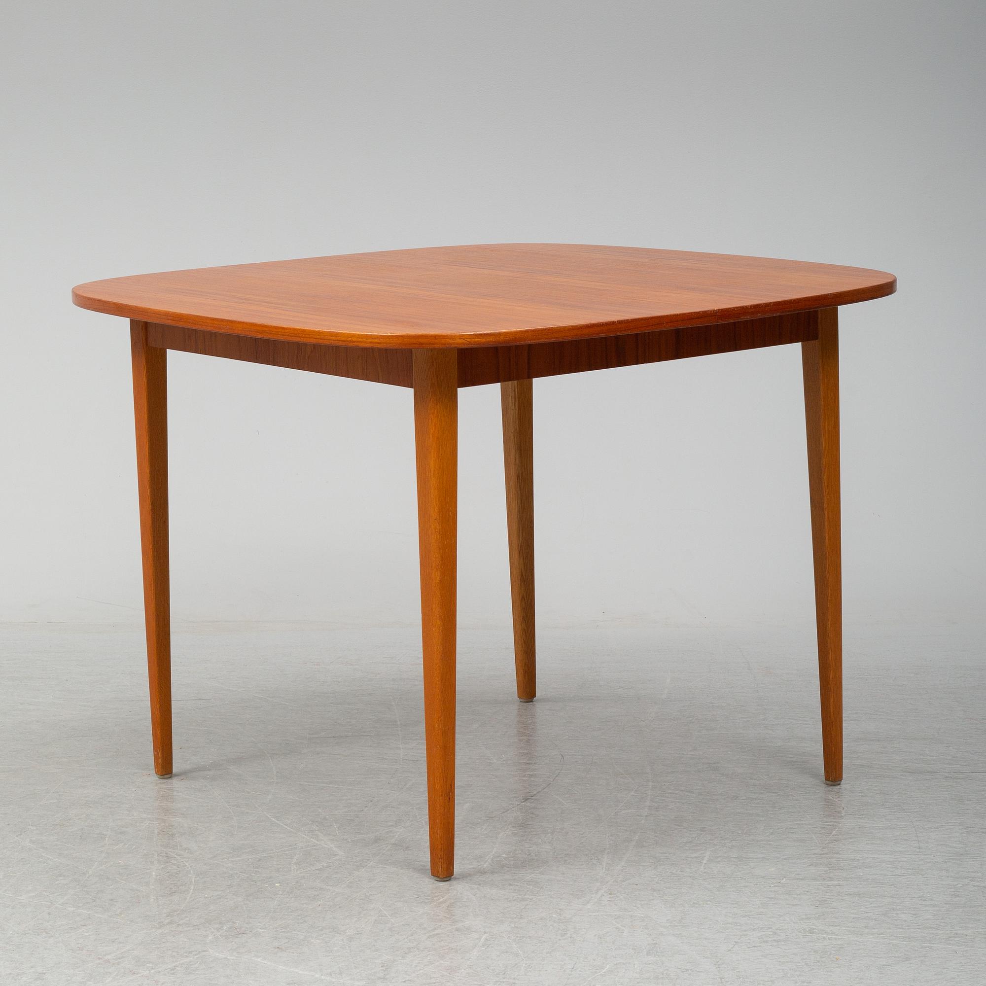 A second half of the 20th Century teak dining table.