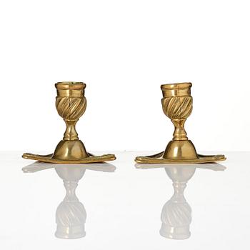 A pair of rococo brass candlesticks by Petter Hemming (master in Stockholm 1771-1807), 1772.
