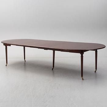 A mid 20th century mahogany veneered dining table by AB Harald Westerberg, Stockholm.