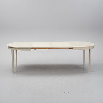 A dining table and six chairs by Carl Malmsten for Bodafors.