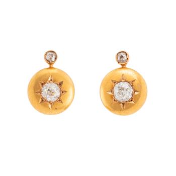 506. A pair of 18K gold earrings set with old-cut diamonds.
