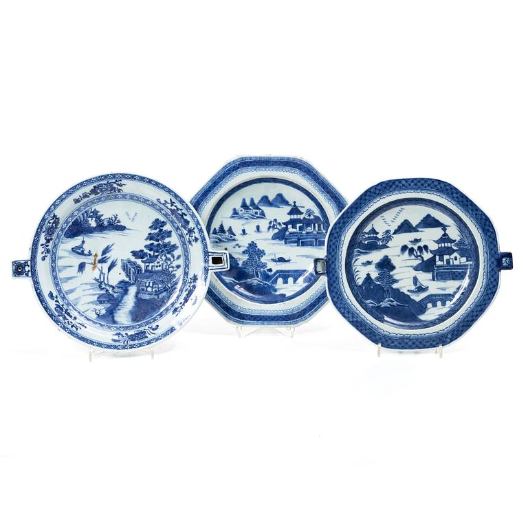 A group of three Chinese blue and white porcelain hot water dishes, Qing dynasty, 18/19th century.
