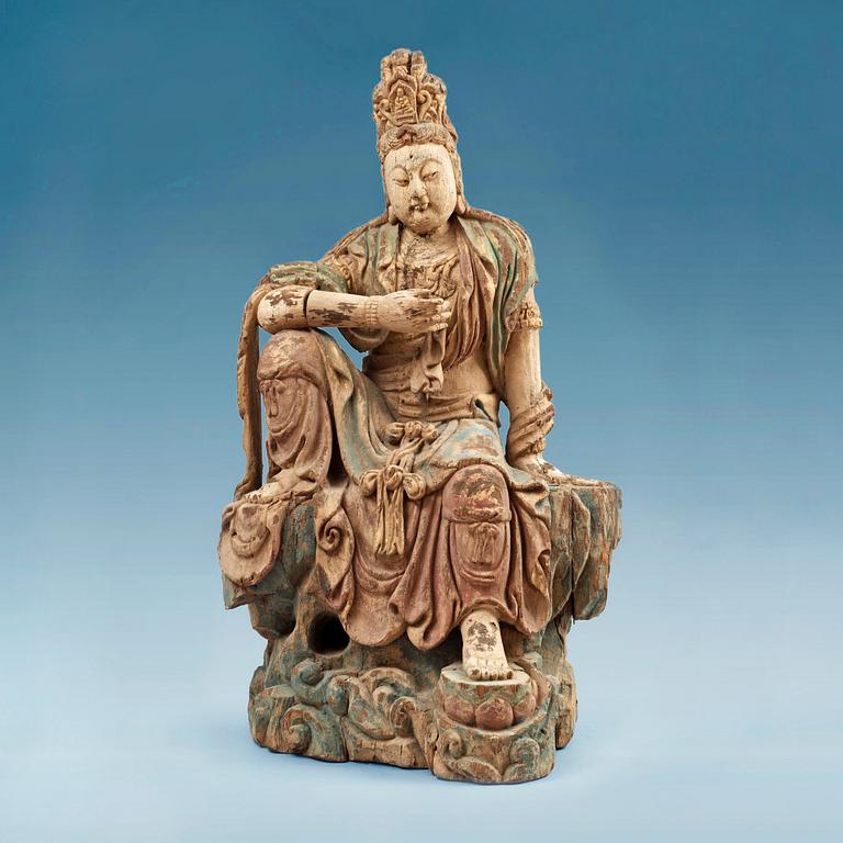 A seated wooden figure of Guanyin, presumably Ming dynasty (1368-1644).
