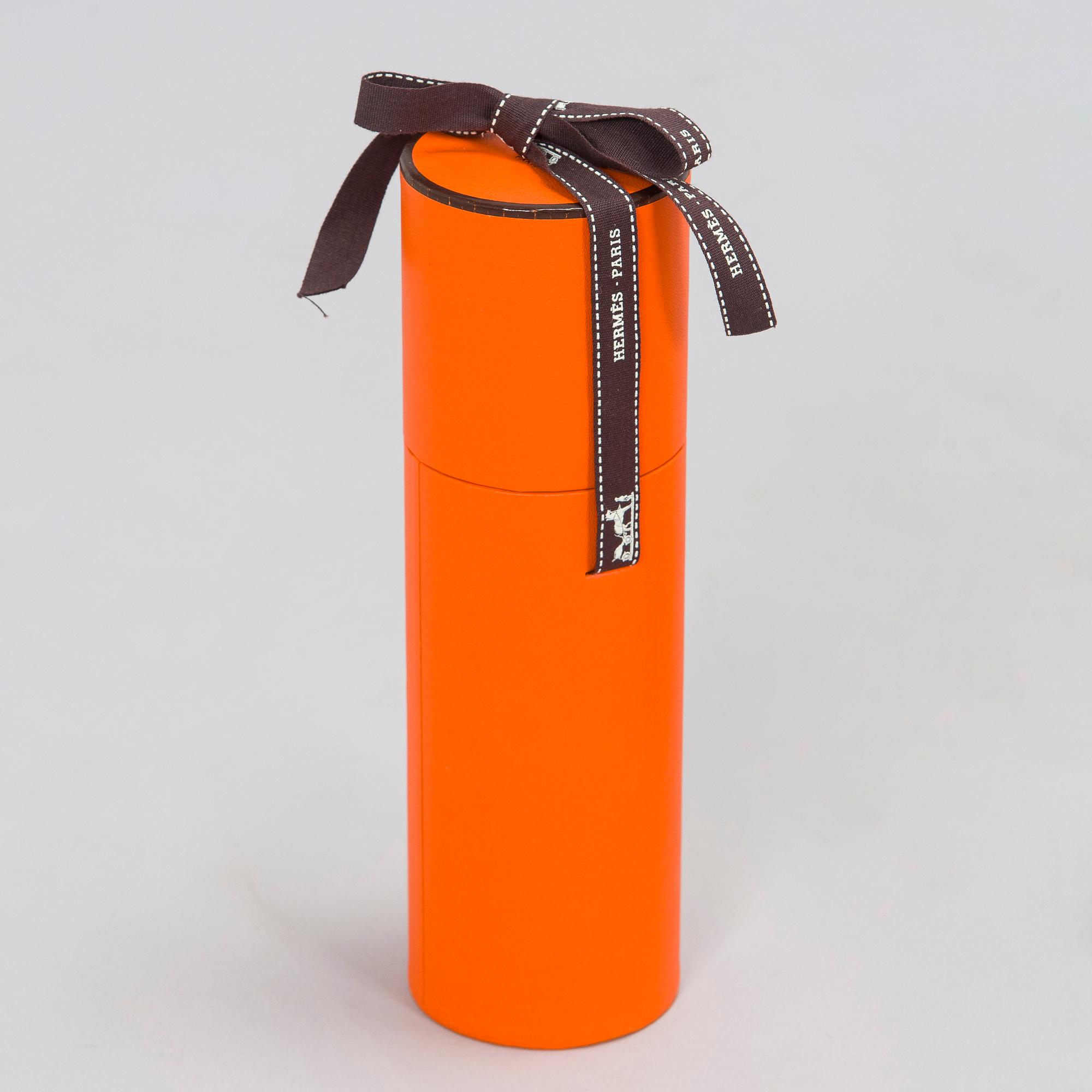 Hermès, a 'Collier de Chiens Maxi Twilly' silk scarf.