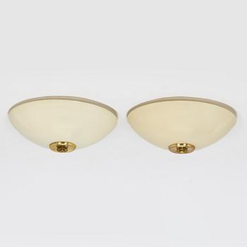 A pair of mid-20th century 'EA 72 ceiling lights for Itsu.
