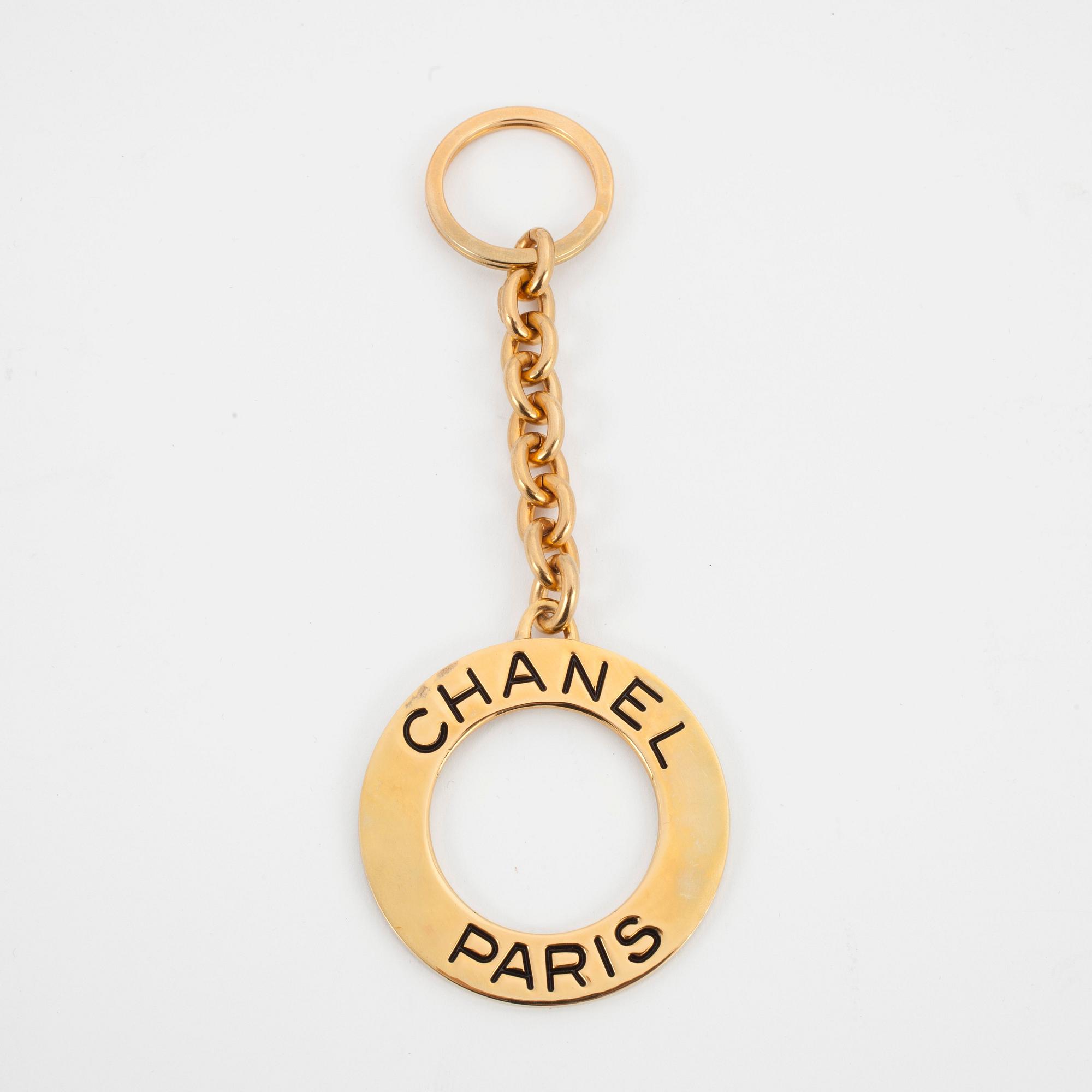 CHANEL, a golden key-ring.