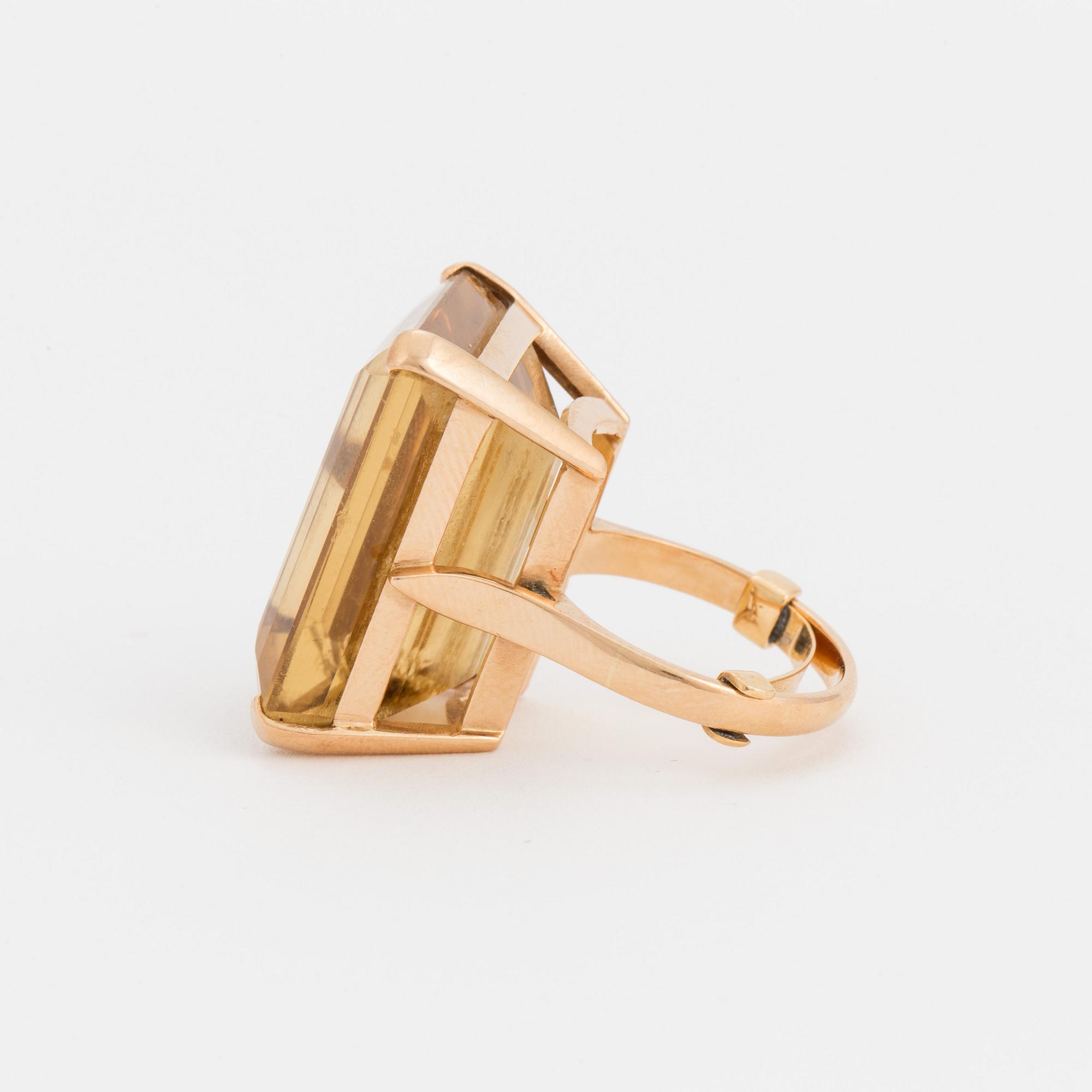 A ring set with a step-cut citrine.