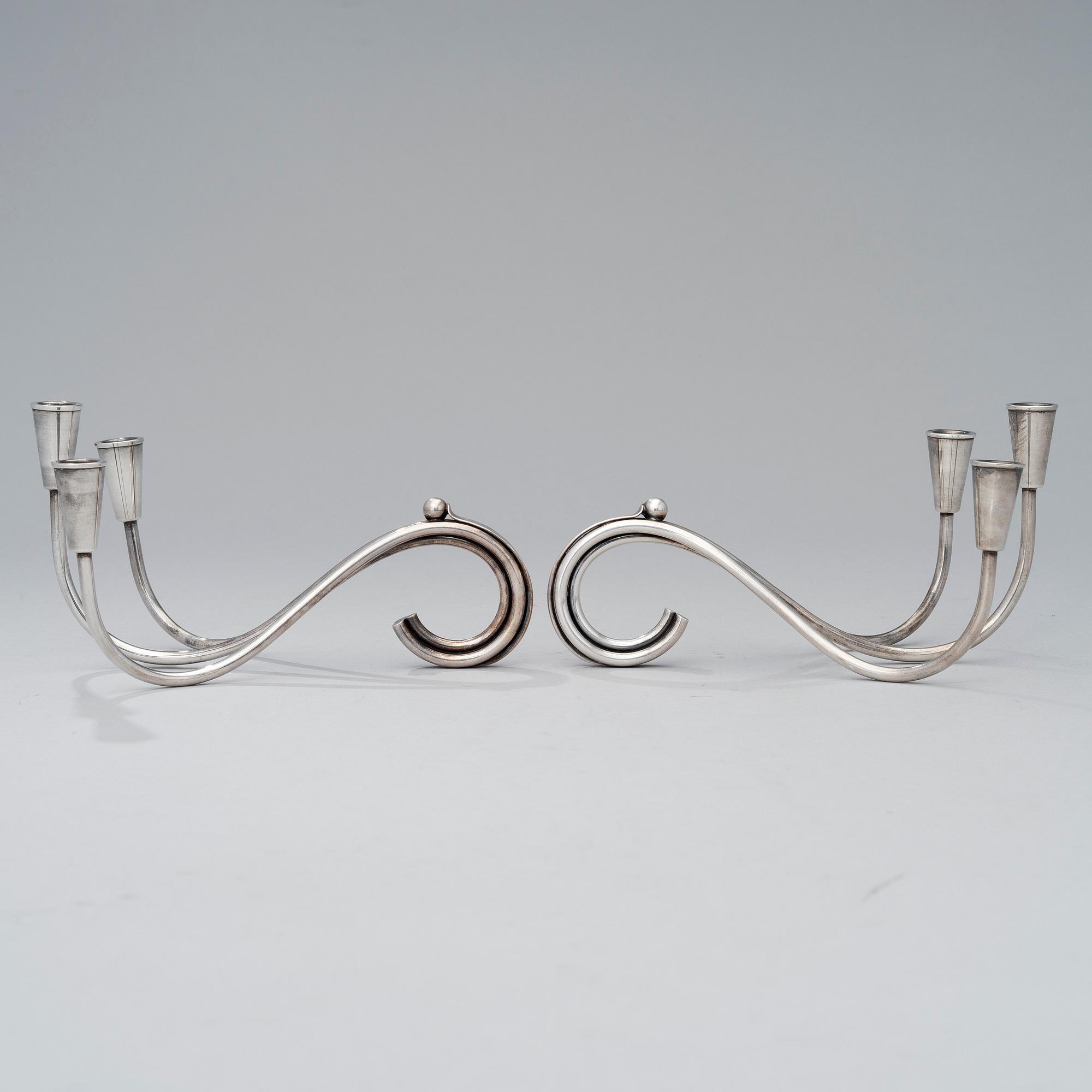 A pair of silver plated candelabra and a candelabrum, FDG, Denmark, mid 20th century.