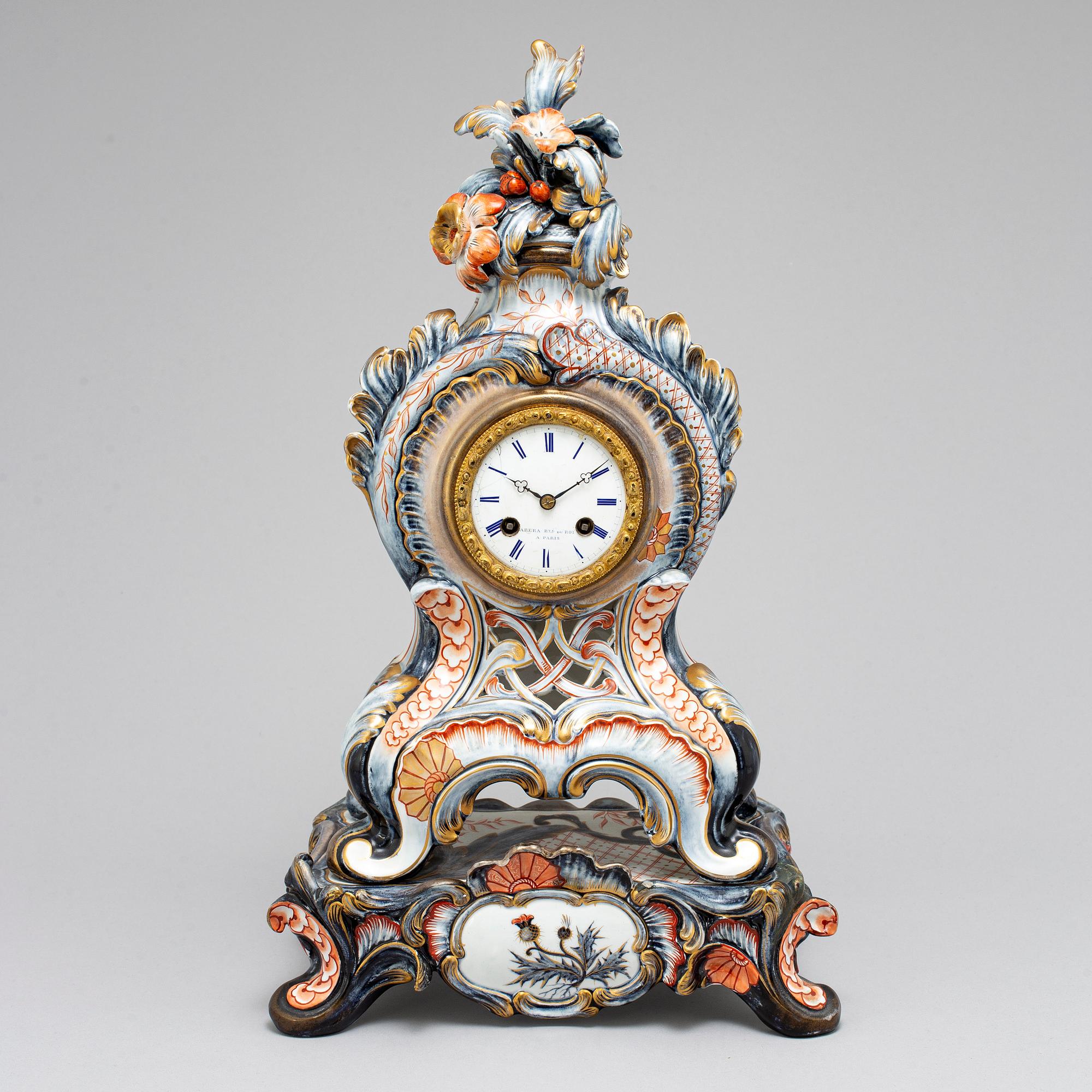 A new rococo creamware bracket clock, after Meissen model, early 20th century.