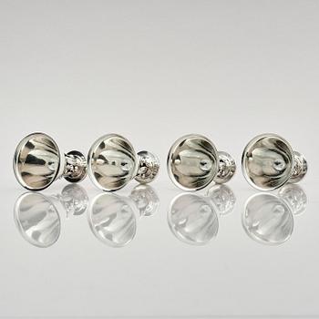 Evald Nielsen, four sterling silver beakers/cups on a foot, Denmark 20th century.