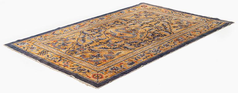 An antique Imperial silk 'Five dragon' palace rug, Qing dynasty, 1880. Measure approx. 238 x 154.5 cm.