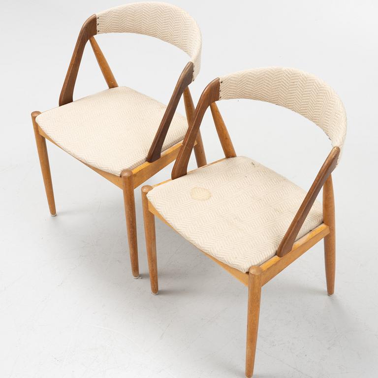 Kai Kristiansen, four walnut and oak 'Pige/T21' chairs, Denmark, 1950's/60's. Table included.