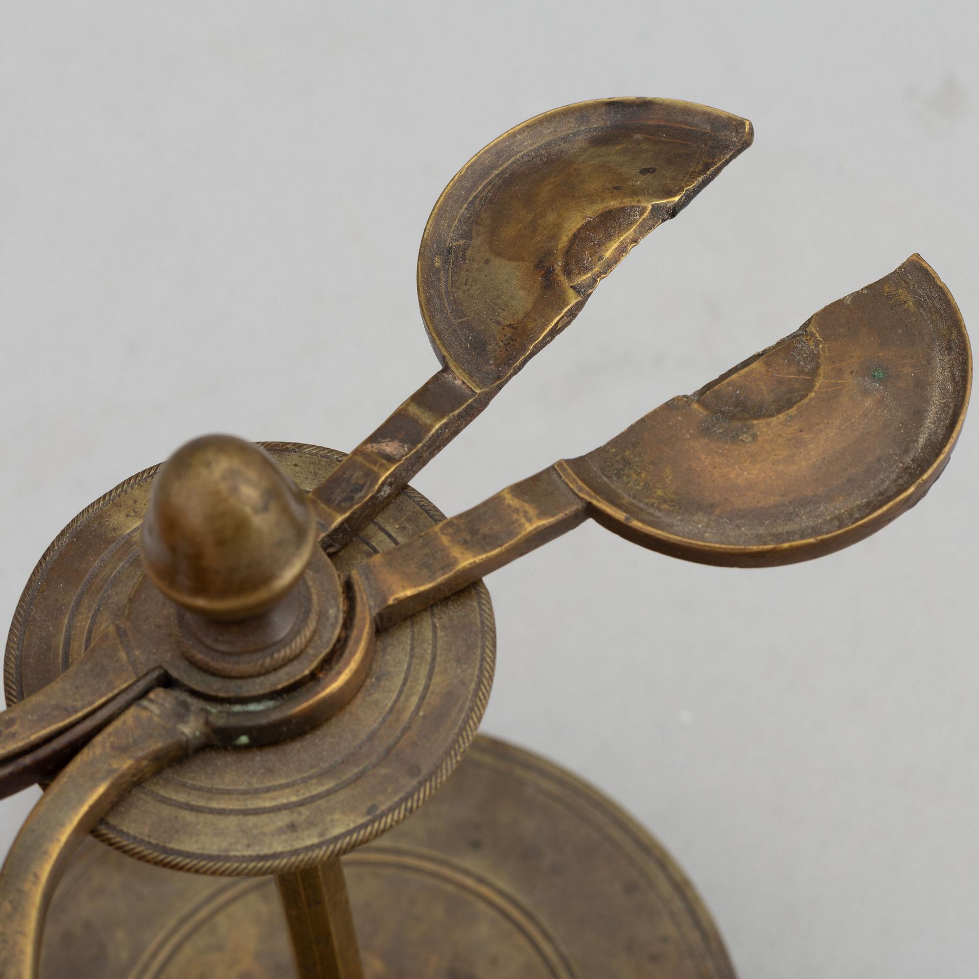A 18th Century brass candle holder.